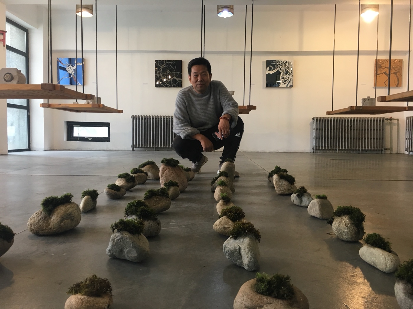 Artist among the moss stones, gallery view